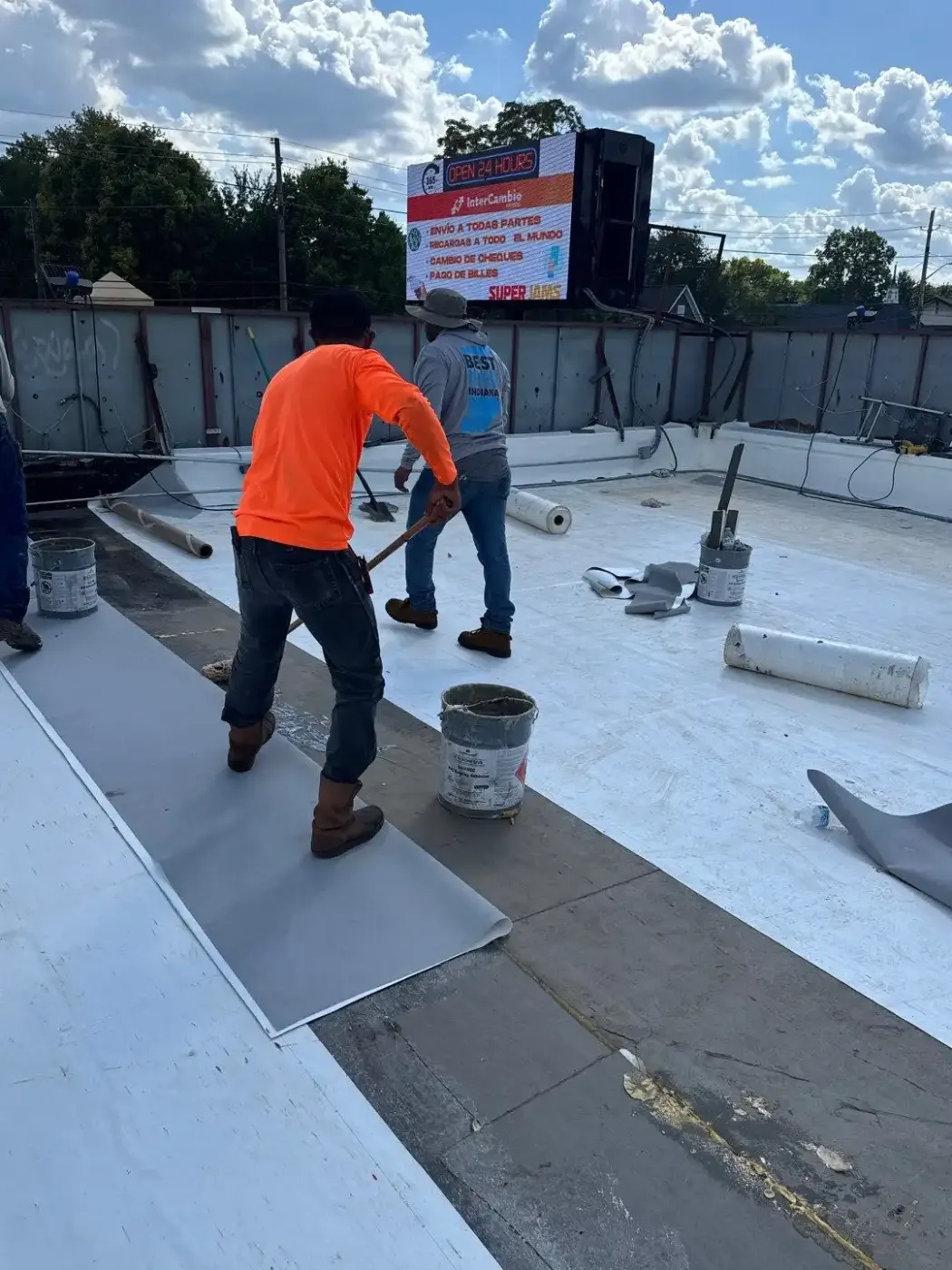 Tarping and dry-in on a Sullivan commercial roof